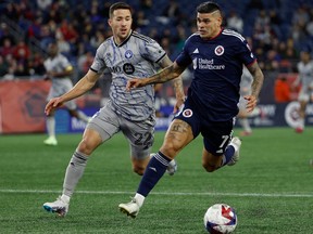 New England Revolution forward Gustavo Bou (7) races past CF Montréal defender Aaron Herrera (22) with the ball during the second half at Gillette Stadium in Foxborough, Mass., on Saturday, April 8, 2023.