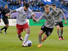 Vaughan SC midfielder Chris Mannella, left, and CF Montréal midfielder Bryce Duke chase the ball during a game at Saputo Stadium on Tuesday.