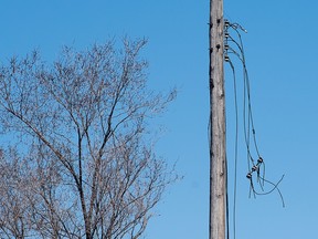 Disconnected power lines are shown in Montreal, Sunday, April 9, 2023.