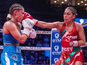 Montreal's Kim Clavel absorbs a blow to the face by Yesica Nery Plata during their WBA/WBC unification bout in Laval in January.