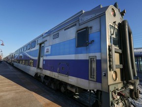 An Exo commuter train against a blue sky.