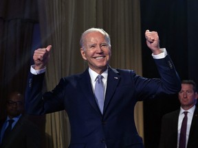 U.S. President Joe Biden acknowledges the crowd during an event in Washington on April 25. Biden announced Tuesday his bid "to finish the job" by running for re-election in 2024.