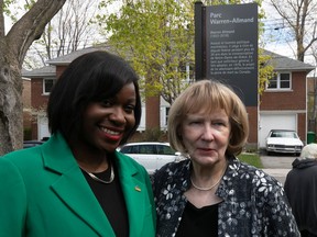 Côte-des-Neiges—Notre-Dame-de-Grâce borough mayor Gracia Kasoki Katahwa, left, and the widow of Warren Allmand, Rosemarie Nolan Allmand, in front of the plaque following the inauguration.