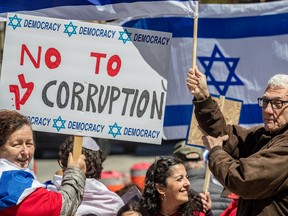 Montrealers supporting democracy in Israel, like Nina Brandis and Jean-Charles Le Brun, attended a peaceful rally in Westmount on Friday May 5, 2023 in support of the hundreds of thousands of Israelis protesting judicial reforms.
