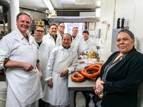 Quebec Smoked Meat owner Richard Nower, left, and staff are seen on Thursday May 11, 2023.