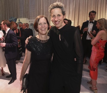 Dr. Lesley Fellows (right), incoming Dean of Faculty of Medicine and Health Sciences at McGill, with her wife Dr. Beth Foster, Chair of the departmentt of Pediatrics and pediatrician in chief at the Montreal Children's Hospital, at the Bal des Tannants for the Children's in the Dorval area of Montreal on Friday, May 12, 2023. The event, in which guests were invited to show up with childish accents in their dress as a way to let their 'inner brats' show, was put on by the Montreal Children's Hospital Foundation and held in Starlink Aviation's hangar.