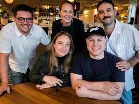 Vanya Filipovic and her husband Marc-Olivier Frappier, sitting, with other co-owners Marc Antoine Gélinas, left, Jessica Noel, centre, and Alex Landry of Mon Lapin. The restaurant was named best in Canada by Canada's 100 Best Restaurants and also topped a list by Maclean's.