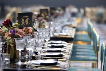 Elaborate table settings at a fundraising dinner