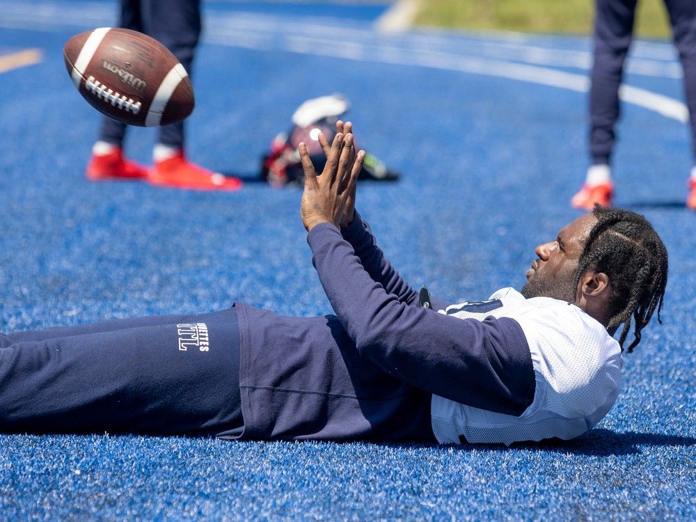 It's hot. Just lie in the grass, like receiver Quartney Davis catching a football while horizontal at Montreal Alouettes training camp practice in Trois-Rivières May 29, 2023.