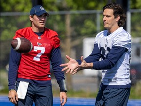 Greg Ellingson, right, catches a pass next to Cody Fajardo