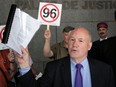 Andrew Caddell, president of the Task Force on Linguistic Policy, brandishes a lawsuit to overturn Bill 96, that his organization filed at the Montreal courthouse on Wednesday, May 31, 2023.