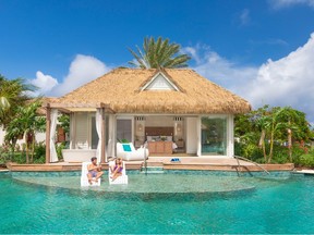 thatched roof luxury cabin at Sandals Royal Curaçao