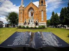 A memorial to the victims of the 2013 rail disaster in front of Eglise Sainte-Agnès in the town of Lac-Mégantic on July 3, 2015.