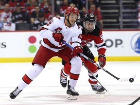 Hurricanes' Jesperi Kotkaniemi battles Devils' Timo Meier for the puck during the second round of this year's playoffs on May 7 in New Jersey.