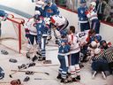 Players pair off during a bench-clearing brawl  between the Canadiens and Nordiques on April 20, 1984. Montreal went on to defeat Quebec 5-3 and won the playoff series 4-2.
