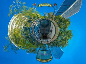 A Little Planet panorama view of the Square-Victoria entrance of the Montreal Metro's Orange Line on Thursday, September 29, 2016. Hector Guimard's art nouveau metro entrance portico at the centre of Square-Victoria was gifted to Montreal by the City of Paris in 1967. The station entrance is one of only four open-air entrances on the Montreal métro network.