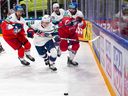 USA defenceman Lane Hutson, 20, outraces Czech forward Martin Kaut, right, during quarterfinal action at the IIHF World Championships in Tampere, Finland, on Thursday.
