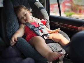 Toddler girl sleeping in child car seat