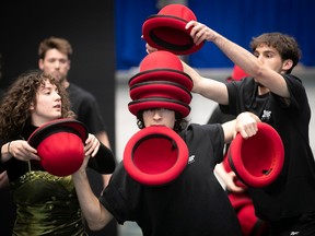 Juggler William Borges receives his red hats as he begins  part of his performance in Parades, the graduate show at the National Circus School, May 16, 2023.