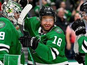 Dallas Stars goaltender Jake Oettinger (29) and centre Max Domi (18) celebrate after the Stars defeated the Seattle Kraken in Game 7 of the second round of the 2023 Stanley Cup Playoffs at the American Airlines Center in Dallas on May 15, 2023.
