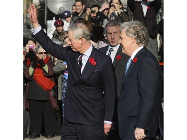 Prince Charles waves to well-wishers on Sherbrooke St. in Montreal after meeting with Premier Jean Charest in 2009.
