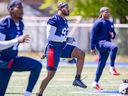 Alouettes defensive end Avery Ellis, centre, trains with the team at Stade Diablos in Trois-Rivières on Monday, May 29, 2023.