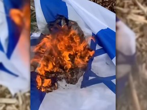 Israeli flags burn in a screengrab from an Instagram video that also showed Israeli flags being ripped down from outside Hebrew Foundation School in Dollard-des-Ormeaux, a Montreal suburb. A youth pled guilty to arson causing property damage.