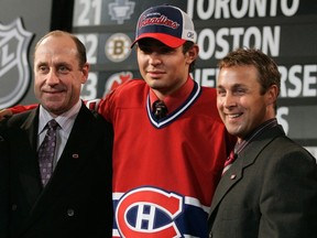 Carey Price is flanked by Bob Gainey and Trevor Timmins