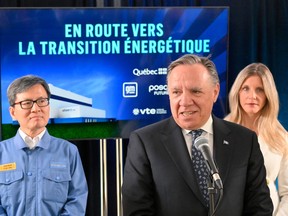 François Legault on stage during an announcement