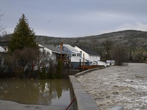 Houses are flooded near the Bras-du-Nord river on May 1, 2023, in downtown Baie-St-Paul.
