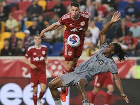 New York Red Bulls defender Sean Nealis (15) and CF Montréal forward Chinonso Offor (9) compete for the ball during the first half at Red Bull Arena on Saturday, May 20, 2023, at Harrison, N.J.