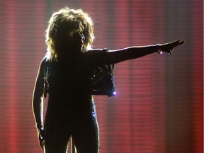 Tina Turner in silhouette on stage