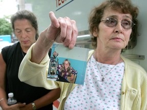 Yvonne Prior holds a picture of her slain daughter Sharron Prior. Daughter Moreen Prior stands next to her mother. Sharron was killed in 1975.