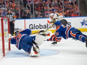 Oilers goalie Stuart Skinner and defenceman Darnell Nurse scramble to try cover an open net in front of Golden Knights' Jonathan Marchessault, who scored a hat trick Sunday night to end Edmonton's Cup hopes.