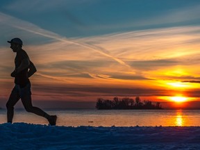 A jogger works out along the waterfront in Dorval in 2020.