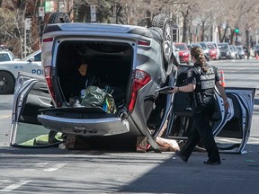 Montreal police officers at the scene of fatal car accident on Papineau which cost the life of a cyclist on Thursday April 8, 2021.