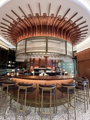 rounded 1920s-style bar with gold accents
