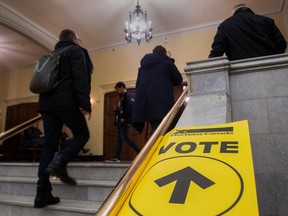 People enter the polling station at Victoria Hall in Westmount to vote in the Notre-Dame-de-Grâce—Westmount riding on Monday, October 21, 2019.