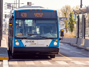 An STM bus waits at the 56th Ave. station during the opening of the SRB Pie-IX bus rapid transit project.