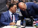 Canadiens executive vice-president of hockey operations Jeff Gorton and general manager Kent Hughes confer during the 2022 NHL entry draft in Montreal.