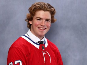 Jacob Fowler poses for a photo in a Canadiens jersey