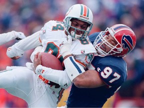 Cornelius Bennett hauls down Gary Clark