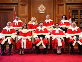 Russell Brown, bottom left, has retired from the Supreme Court of Canada. THE CANADIAN PRESS/Sean Kilpatrick
