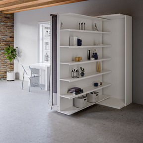 A hidden bed with shelving