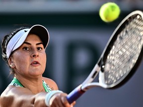 Canada's Bianca Andreescu eyes the ball as he plays against Ukraine's Lesia Tsurenko during their women's singles match on day seven of the Roland-Garros Open tennis tournament at the Court Simonne-Mathieu in Paris on Saturday, June 3, 2023.