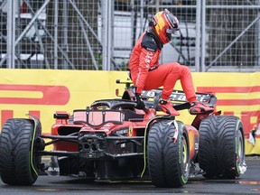 Ferrari driver Carlos Sainz of Spain exits his car after crashing during the third practice session at the Canadian Grand Prix in Montreal on Saturday, June 17, 2023.