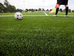A referee and a soccer ball are seen on the new artificial turf at Grier Park in Pierrefonds west of Montreal on Sunday, July 4, 2010.