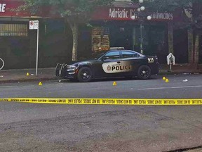 Small yellow cones mark the site of shell casings after a shooting at the corner of East Hastings Street and Columbia Street , which sources say involved a new gang on the Downtown Eastside, Zone 43 from Montreal.