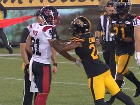 Chris Edwards shoves Austin Mack, who has his hand extended