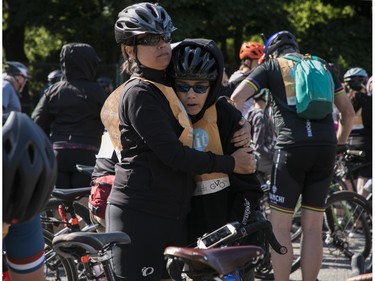Matteo Mollicone has a little yawn while being held by his mother Jasmine Garcia Larouche before the start of the the 38th Tour de l'île de Montréal on Rosemont Blvd. in Montreal on Sunday, June 4, 2023.